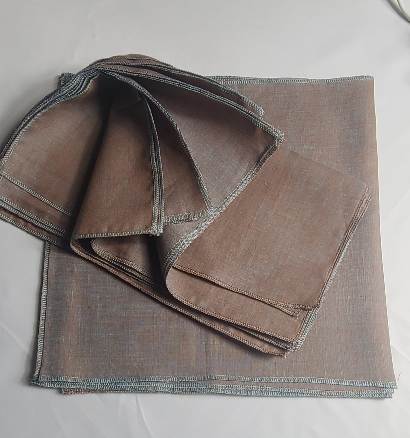 Folded brown fabric on a light gray background