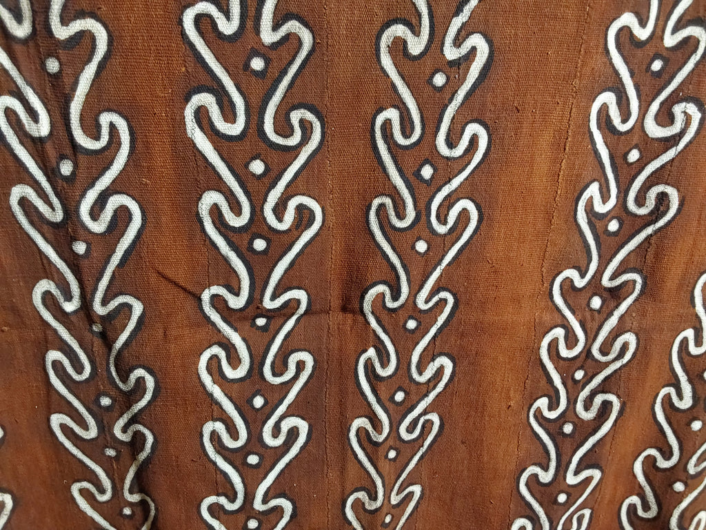 Brown fabric with white geometric pattern