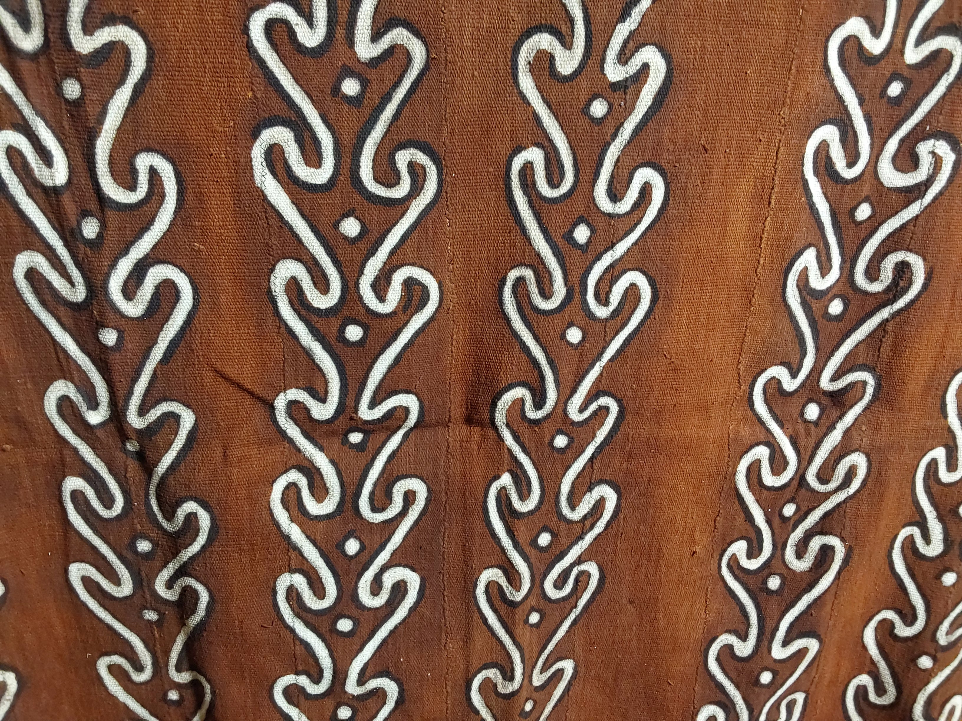 Brown fabric with white geometric pattern