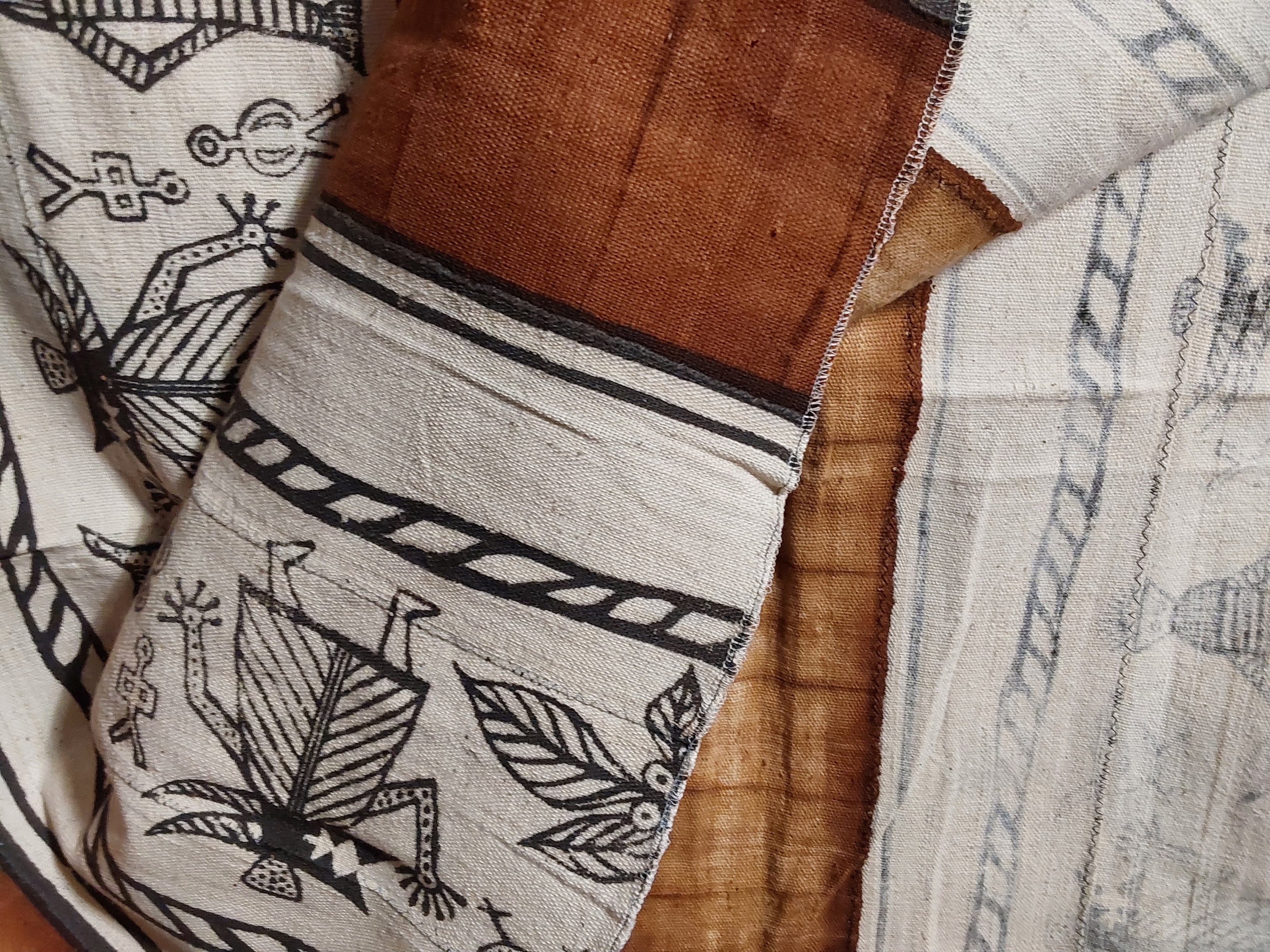 Textile with black patterns on a brown surface