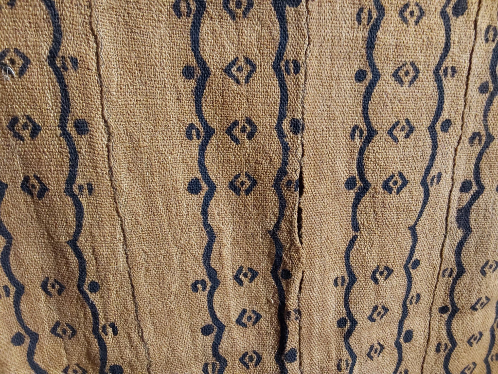 Textile with blue geometric patterns on a beige background
