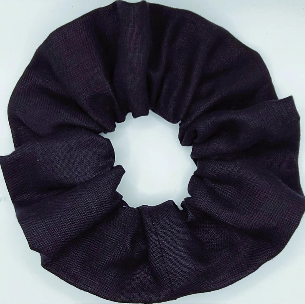 Navy blue scrunchie on a white background