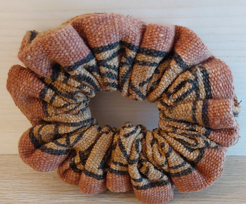 Textured scrunchie with pattern on a wooden surface