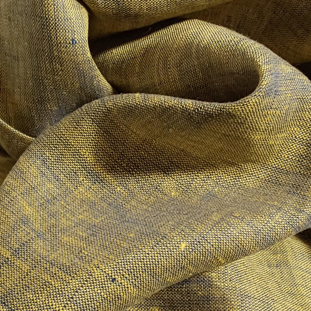 Close-up of textured brown fabric with a subtle pattern