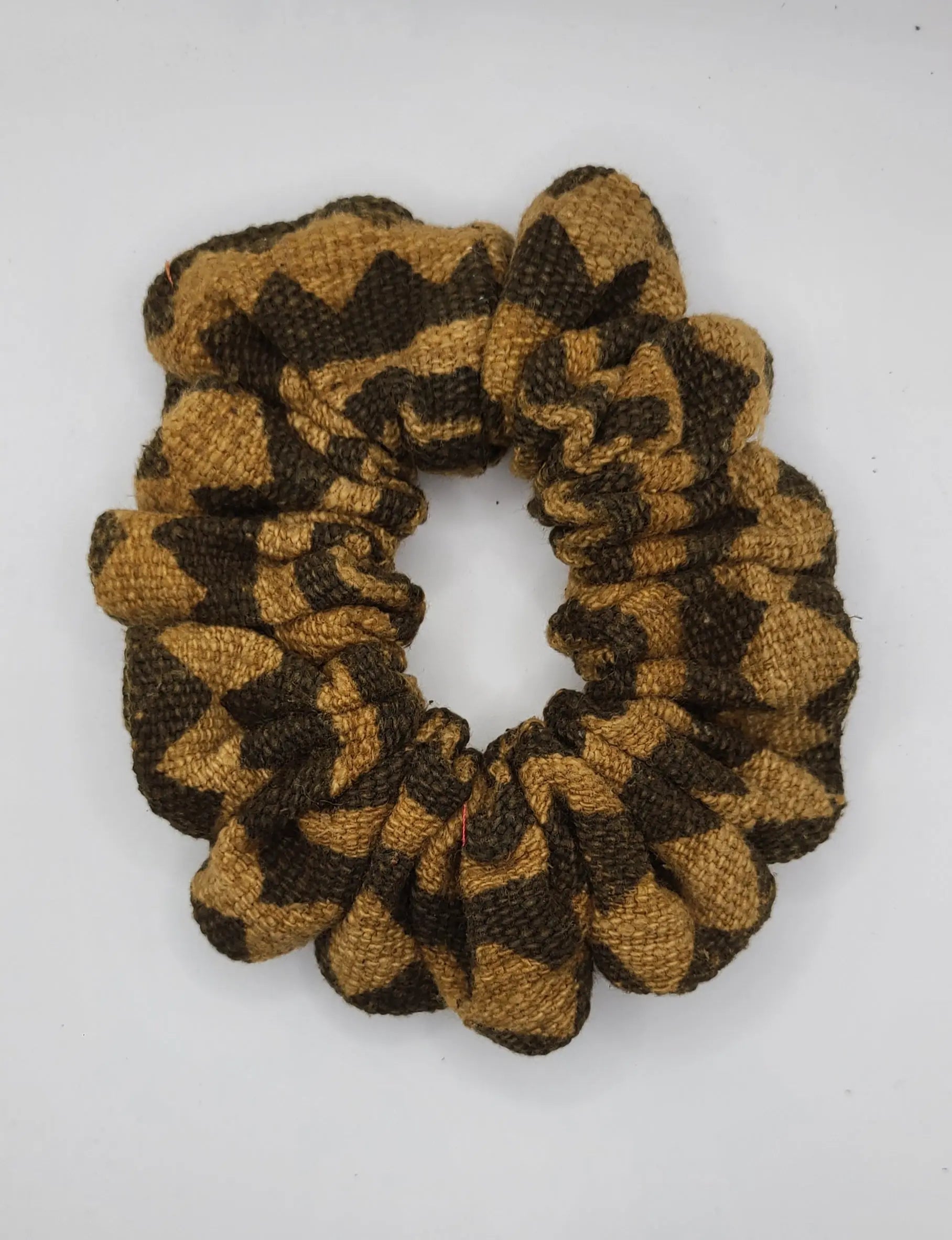 Brown and beige scrunchie on a white background